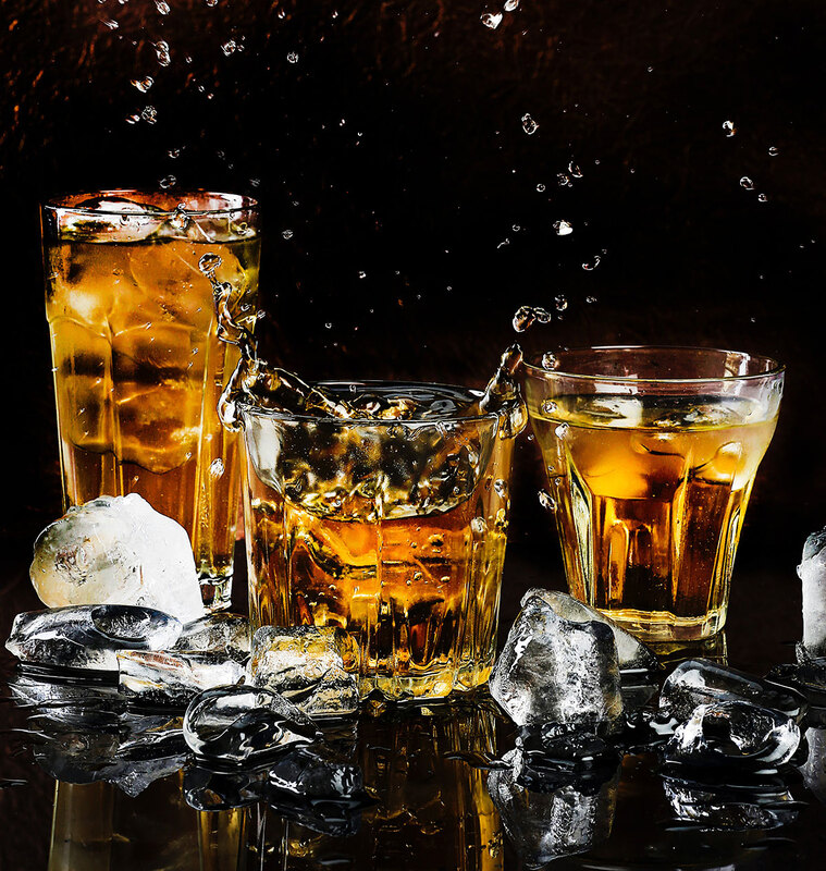 Three glasses of whisky on the rocks