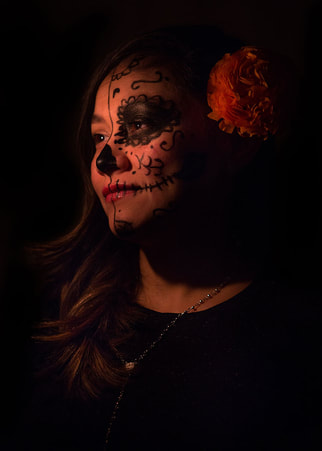 latina with face painted as a Calavera