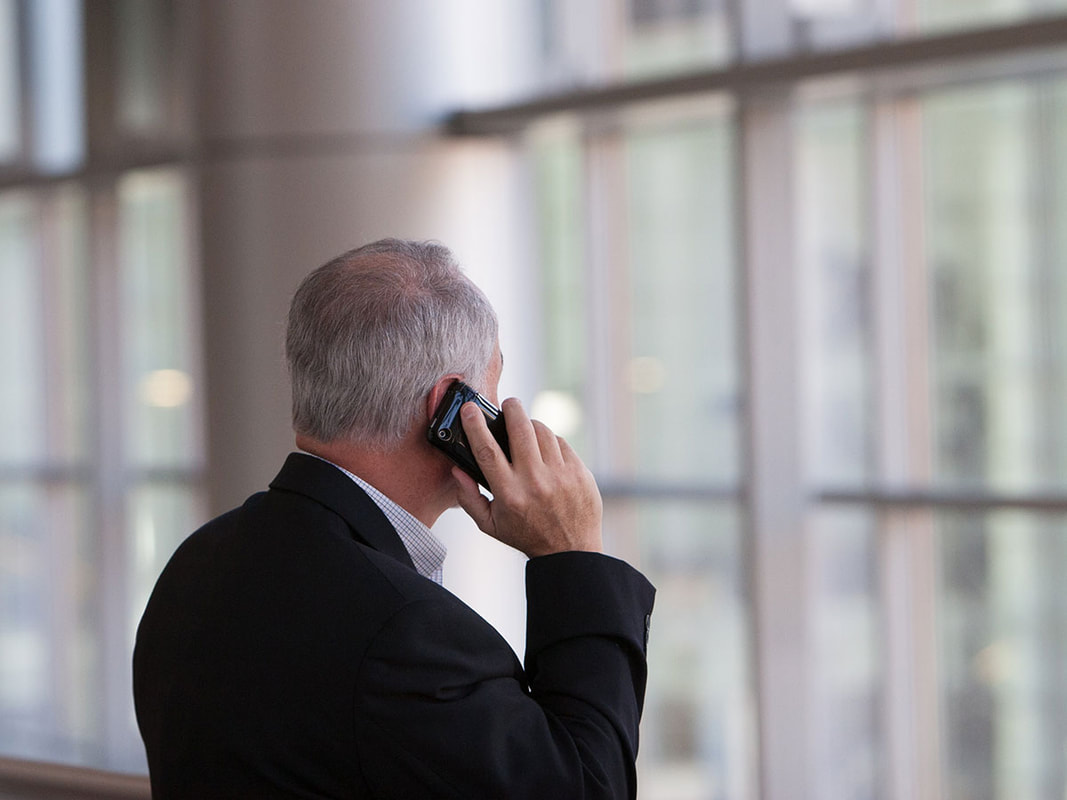 businessman on the phone at an airport
