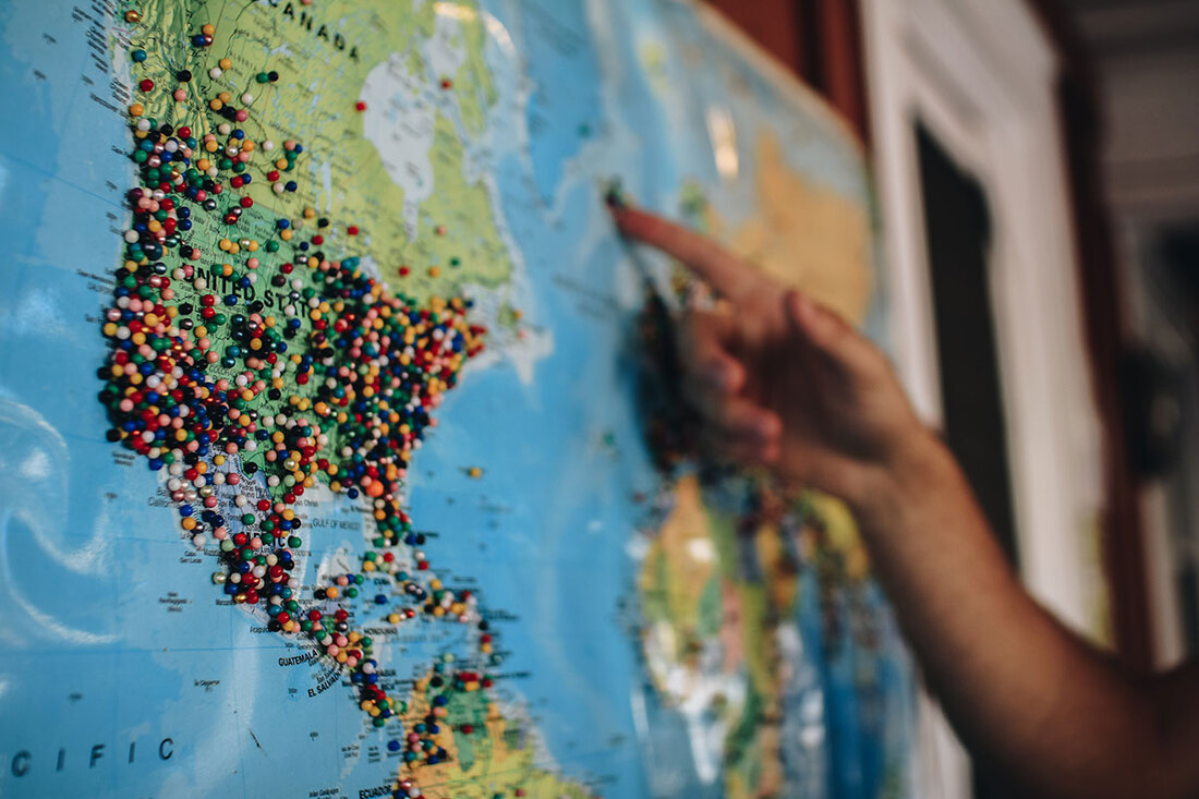 map of the world with pins in it for past travel destinations