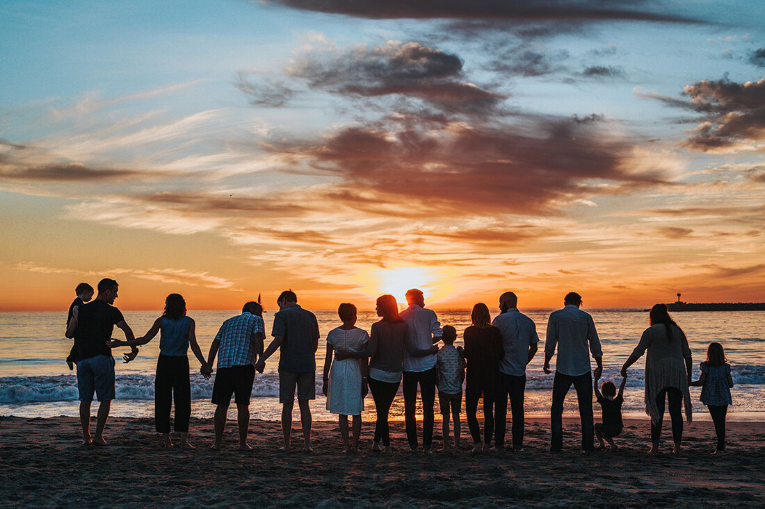 Family on the beach for sunset